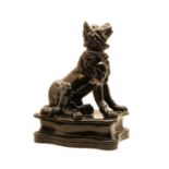 A black glazed stoneware figure of a dog,