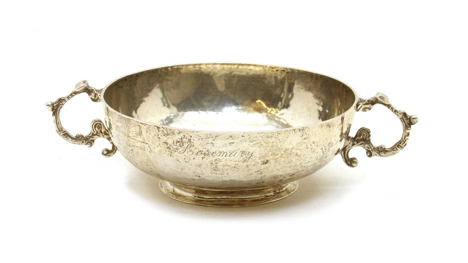 A silver planished twin handled bowl,