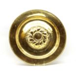 A Jacobean style brass embossed alms dish,