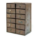 A set of twelve industrial tabletop instrument drawers,