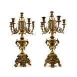 A pair of Rococo-style brass six-light candelabra