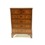 A George III style inlaid mahogany chest of drawers,