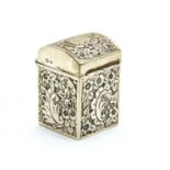 A miniature silver embossed casket with a domed lid,