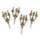 A set of four twin branch wall lights,
