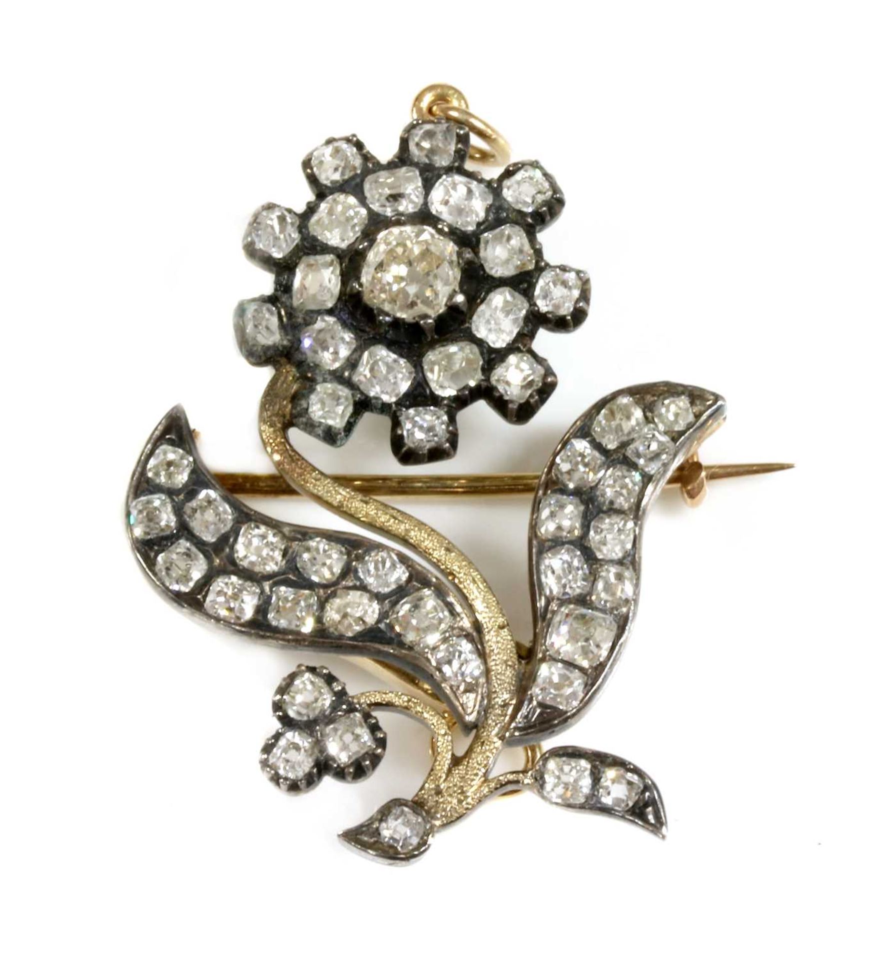 A late Georgian diamond set flower brooch/pendant,