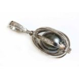 A platinum Tahitian cultured pearl and diamond 'Engage' pendant by Theo Fabergé,