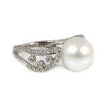 A Continental single stone cultured South Sea pearl ring with diamond set shoulders,