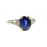 A platinum three stone sapphire and diamond ring,