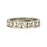 A platinum diamond set half eternity ring,