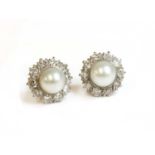 A pair of cultured pearl and diamond cluster earrings,