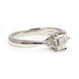 An 18ct white gold three stone diamond ring,