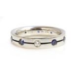 A Swiss platinum, diamond and sapphire set band ring by Furrer-Jacot,