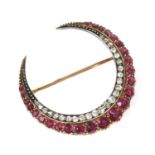 A late Victorian ruby and diamond closed crescent brooch,