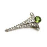 An Art Deco peridot and diamond clip brooch,