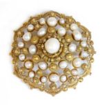 A Continental gold-mounted pearl, shield-form, cluster brooch/pendant,