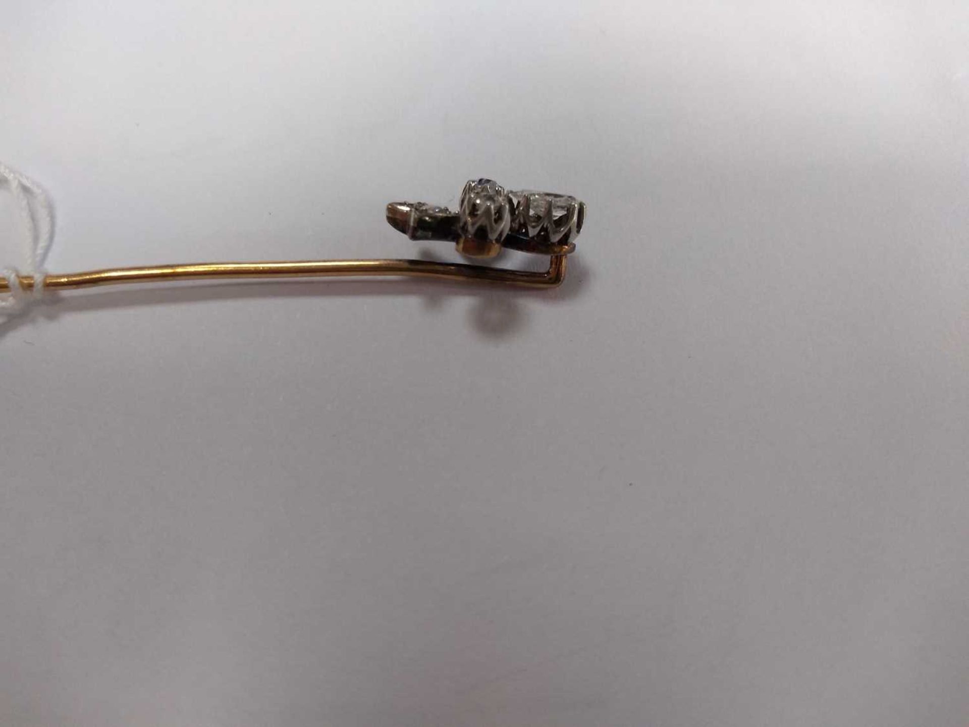 A cased diamond set fleur-de-lys stick pin, early 20th century, - Image 4 of 5