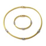 An 18ct yellow and white gold diamond set necklace and bracelet suite by Italian Lynx,