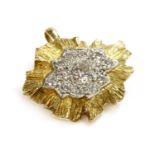 A yellow and white gold diamond set brooch pendant,