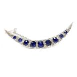 An Edwardian sapphire and diamond crescent brooch, c.1910,