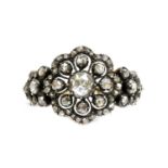 An antique-style diamond set daisy cluster ring,