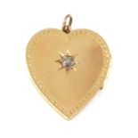 An 18ct gold diamond set heart-shaped hinged locket,