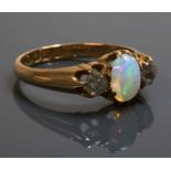 An 18ct gold late Victorian three stone opal and diamond ring,