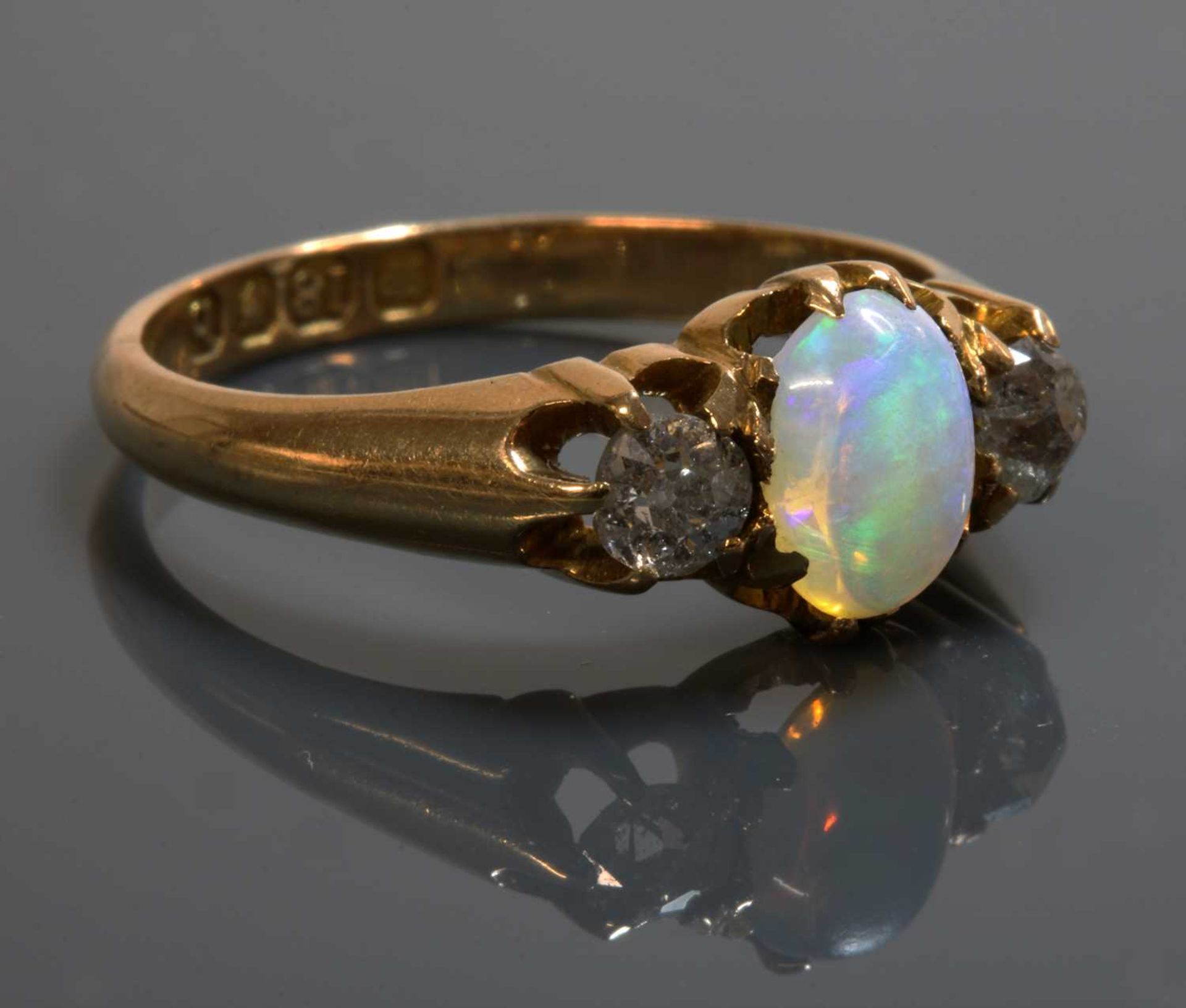 An 18ct gold late Victorian three stone opal and diamond ring,