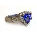 An 18ct white gold tanzanite and diamond trilliant-shaped target cluster ring,