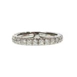 A white gold diamond set full eternity ring,