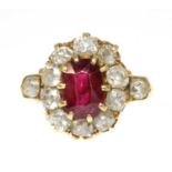 A late Victorian ruby and diamond oval cluster ring,
