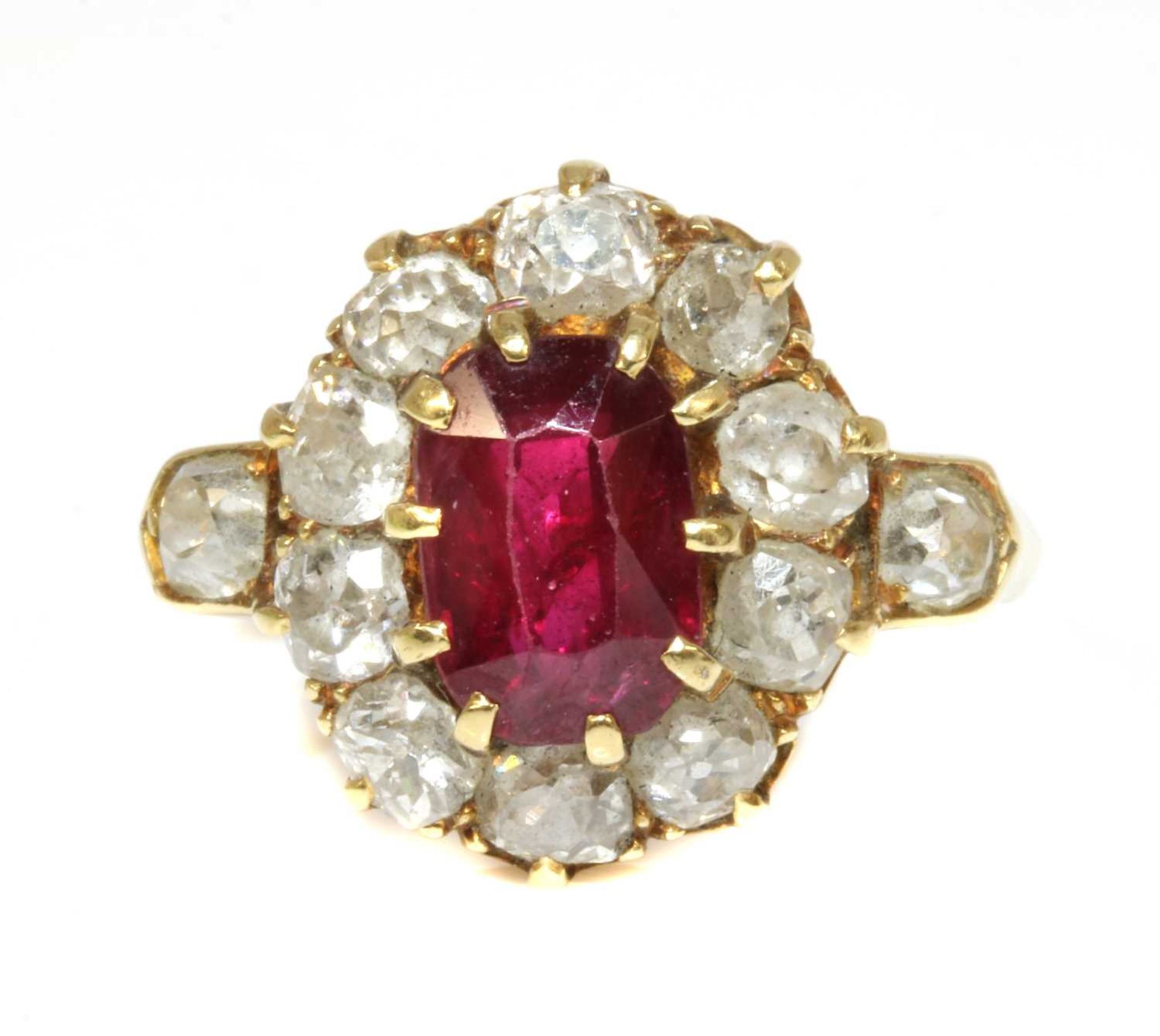 A late Victorian ruby and diamond oval cluster ring,