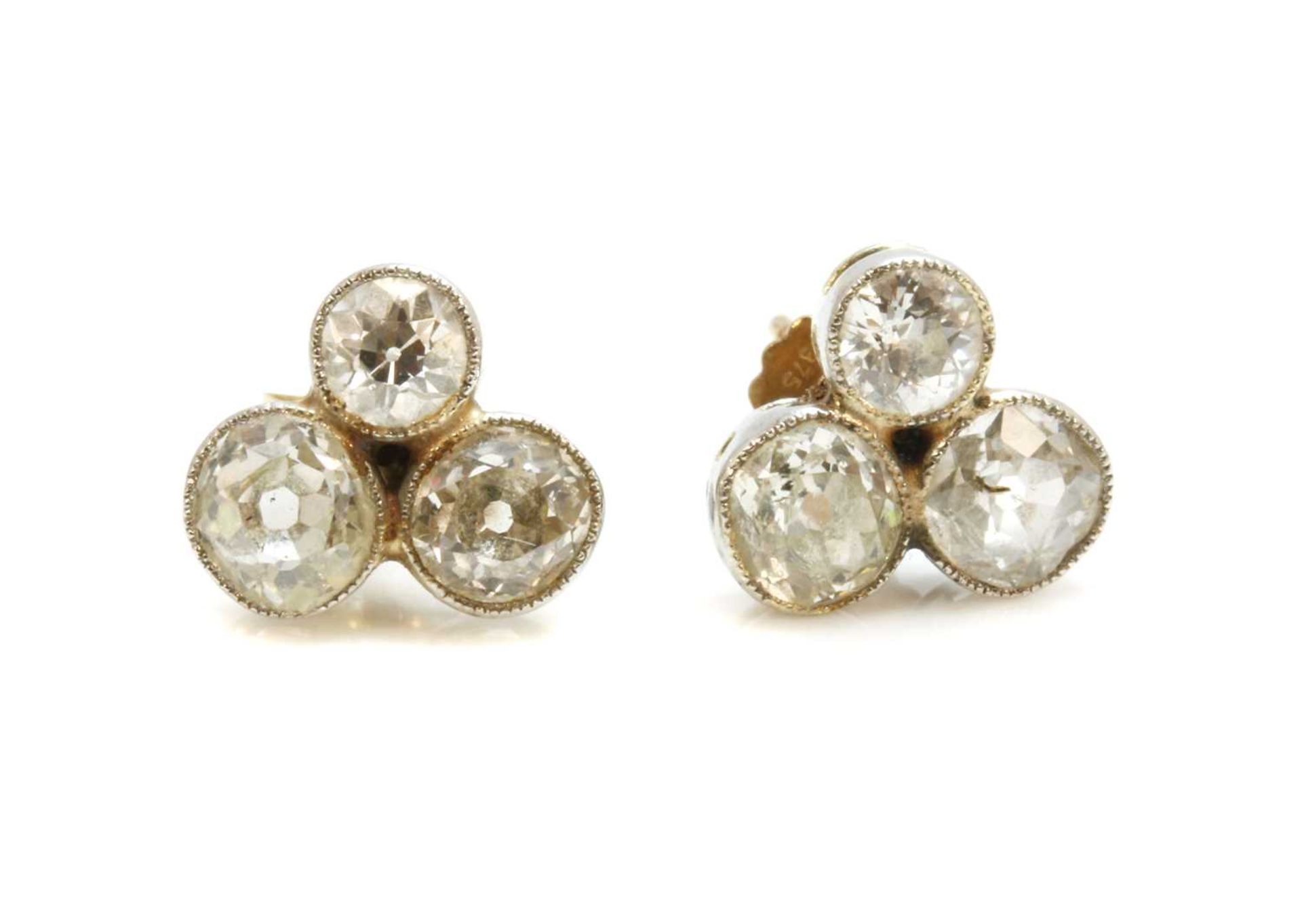 A pair of trefoil diamond cluster stud earrings,