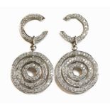 A pair of white gold diamond set target-style drop earrings,