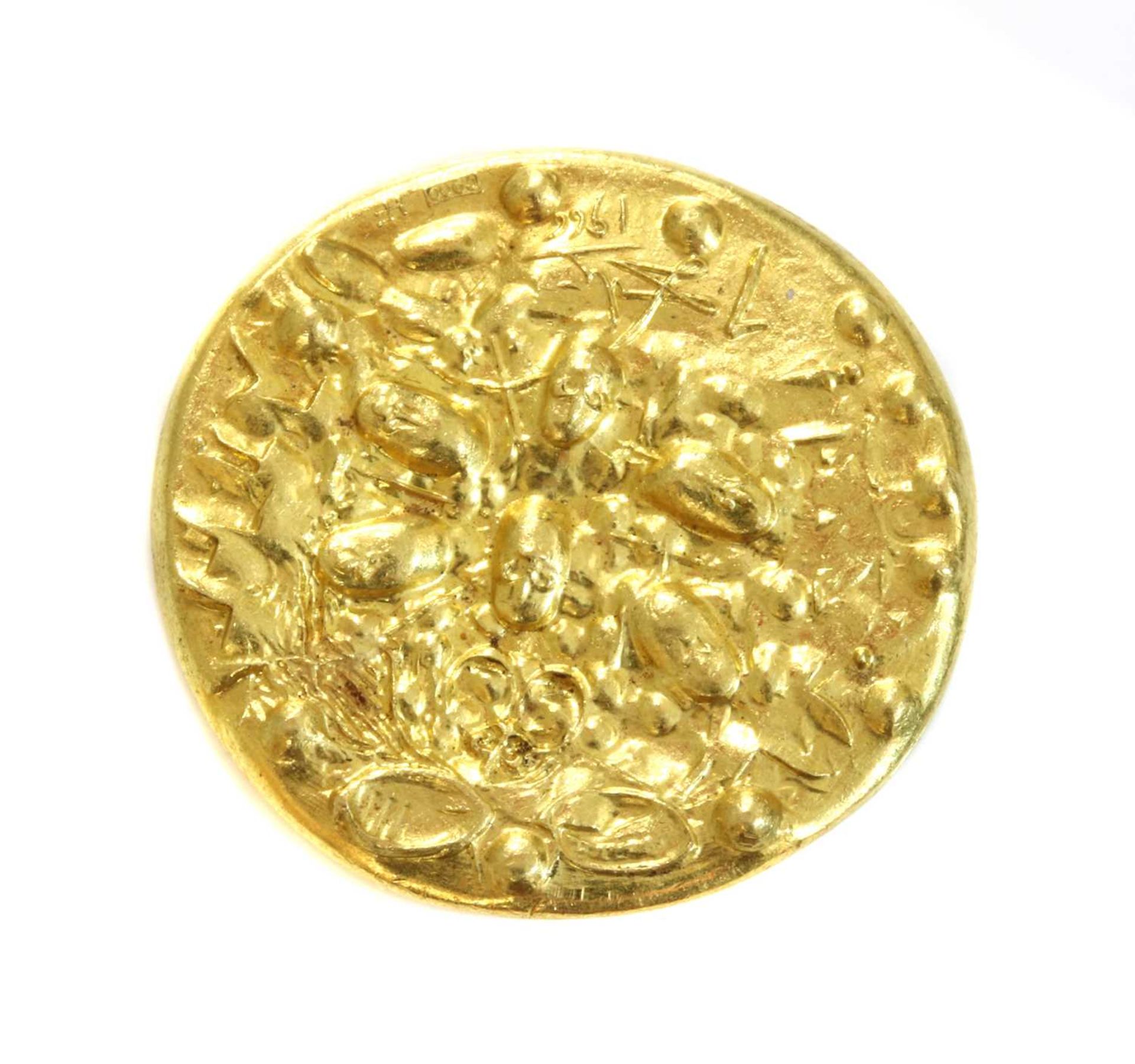 A gold medallion 'Dali d'Or' designed by Salvador Dali, c.1966,