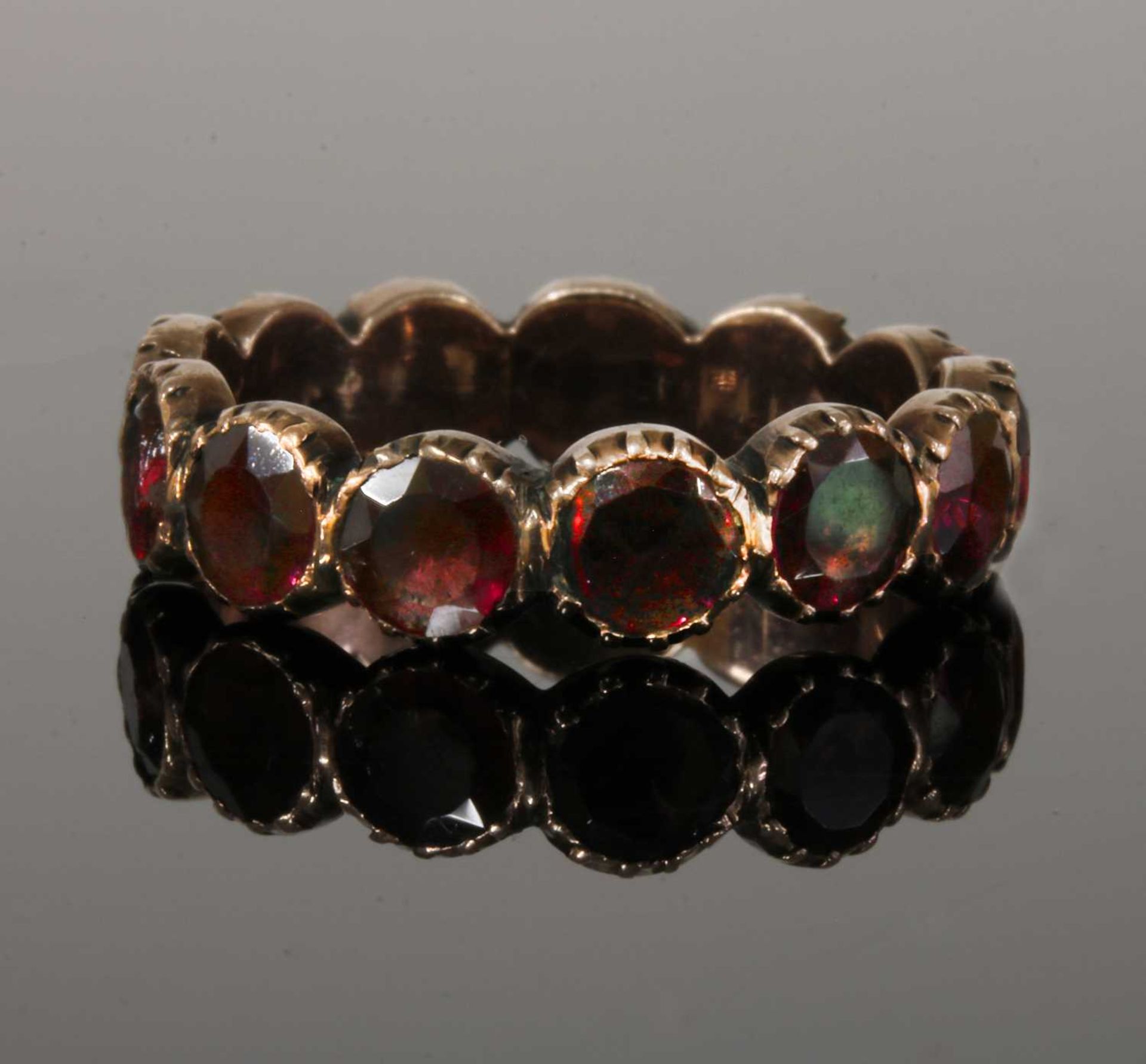 A Georgian foil-backed flat cut garnet eternity-style ring, - Image 2 of 7