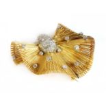 A Continental gold and platinum, diamond set, bow brooch, c.1945-1955,