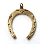 An Edwardian gold horseshoe fob or pendant,