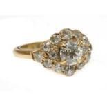 A lozenge-shaped diamond cluster ring,