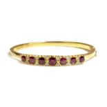 A ruby and diamond hinged bangle,