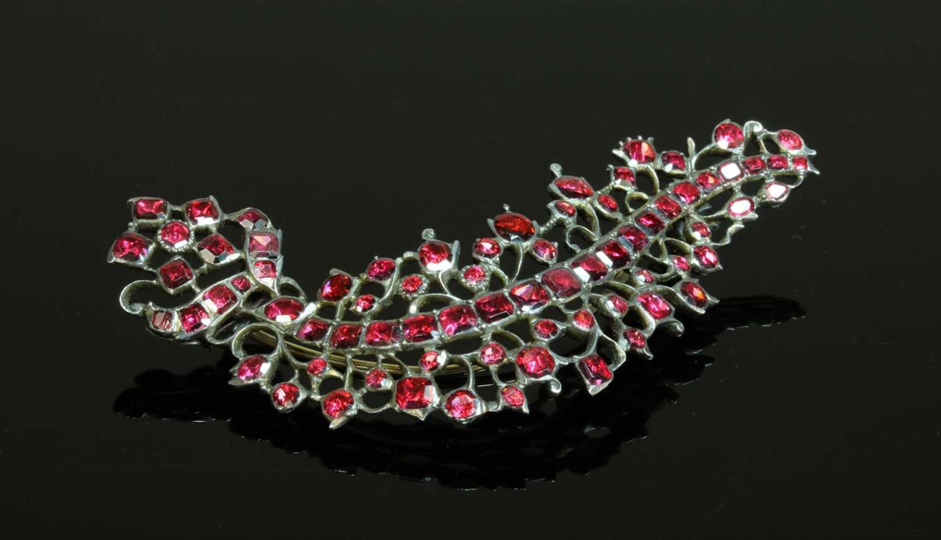 A foil-backed flat cut garnet brooch, - Image 2 of 2