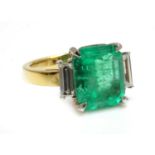 An 18ct yellow and white gold single stone emerald ring,