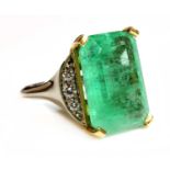 An 18ct yellow and white gold single stone emerald ring,