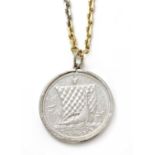 A platinum and 18ct gold coin pendant with an Isle of Man one noble platinum coin,