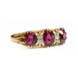 A seven stone ruby and diamond carved head ring,