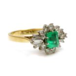 A two colour gold emerald and diamond cluster ring,