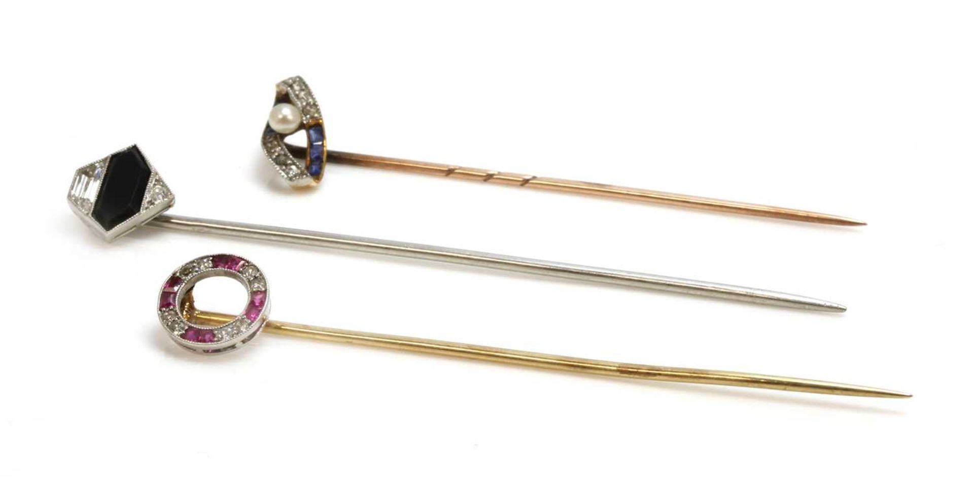 Three Art Deco diamond set stick pins,