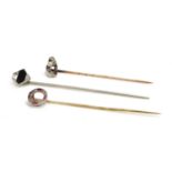 Three Art Deco diamond set stick pins,