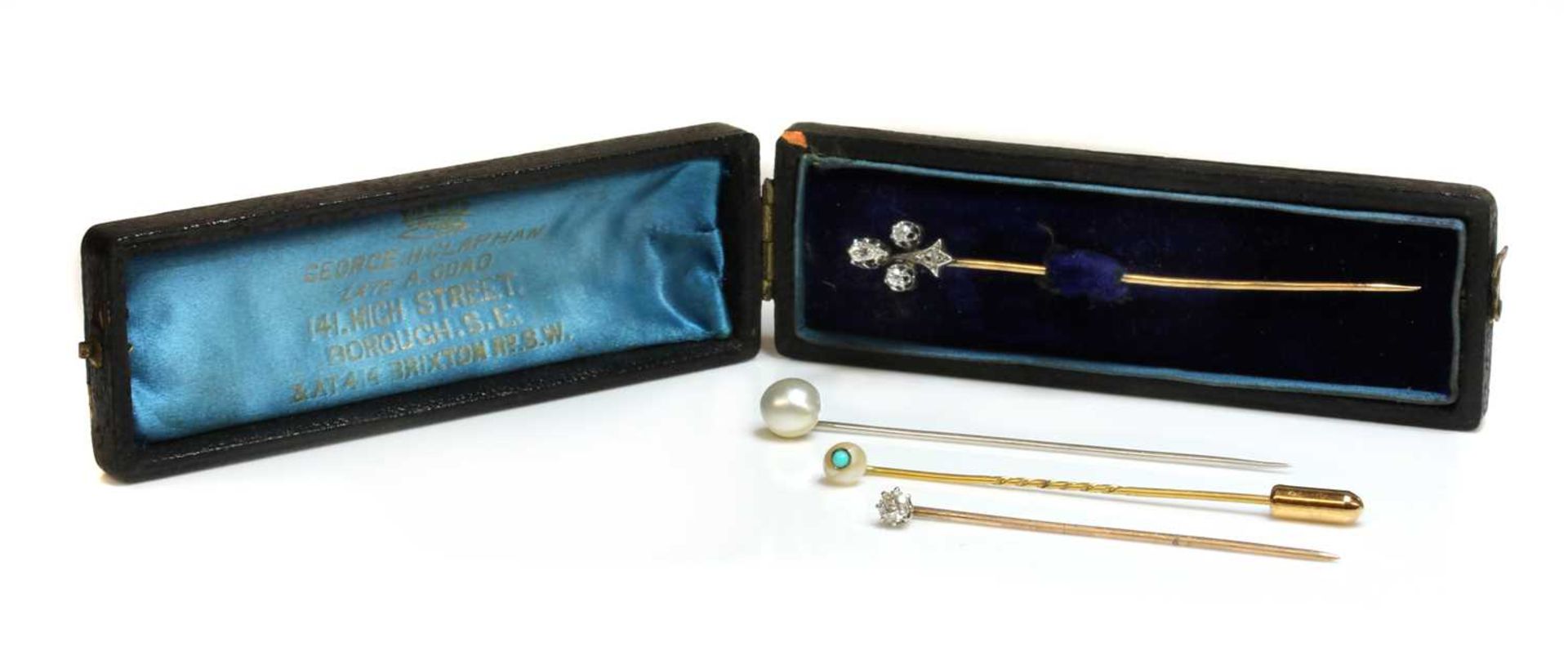 A cased diamond set fleur-de-lys stick pin, early 20th century, - Image 2 of 5