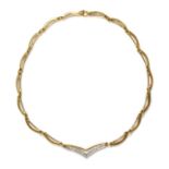 A two colour gold, diamond set, swag necklace with a 'V' shaped centrepiece,