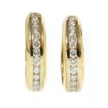 A pair of Continental gold diamond set hoop earrings,